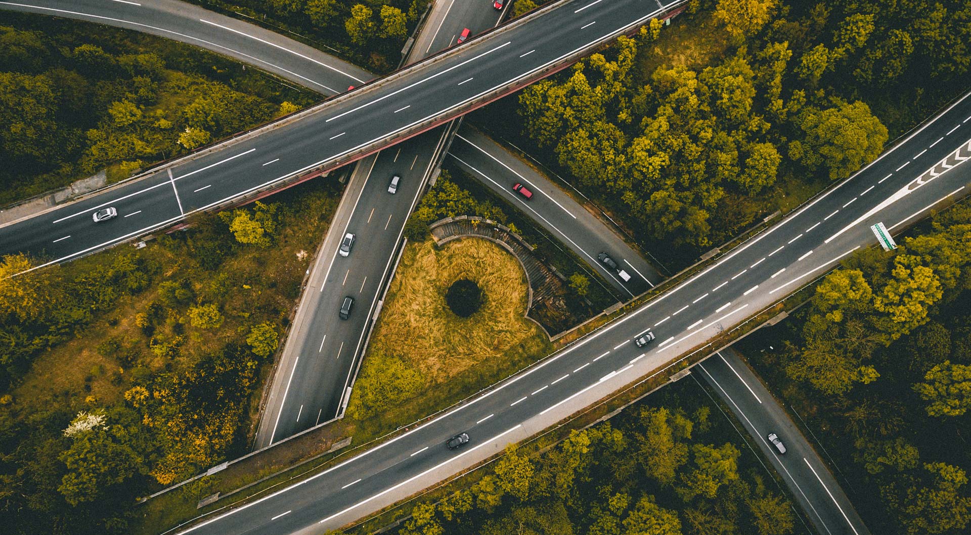 aerial view of highways and surrounding trees